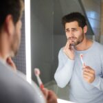 Sad man getting bad tooth