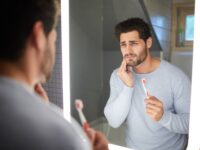 Sad man getting bad tooth