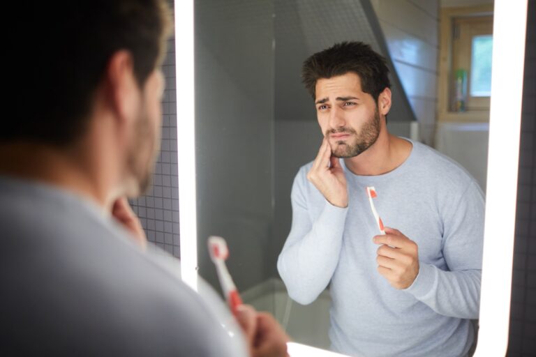 Sad man getting bad tooth